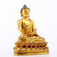 A serene gilt bronze statue of Gautama Buddha