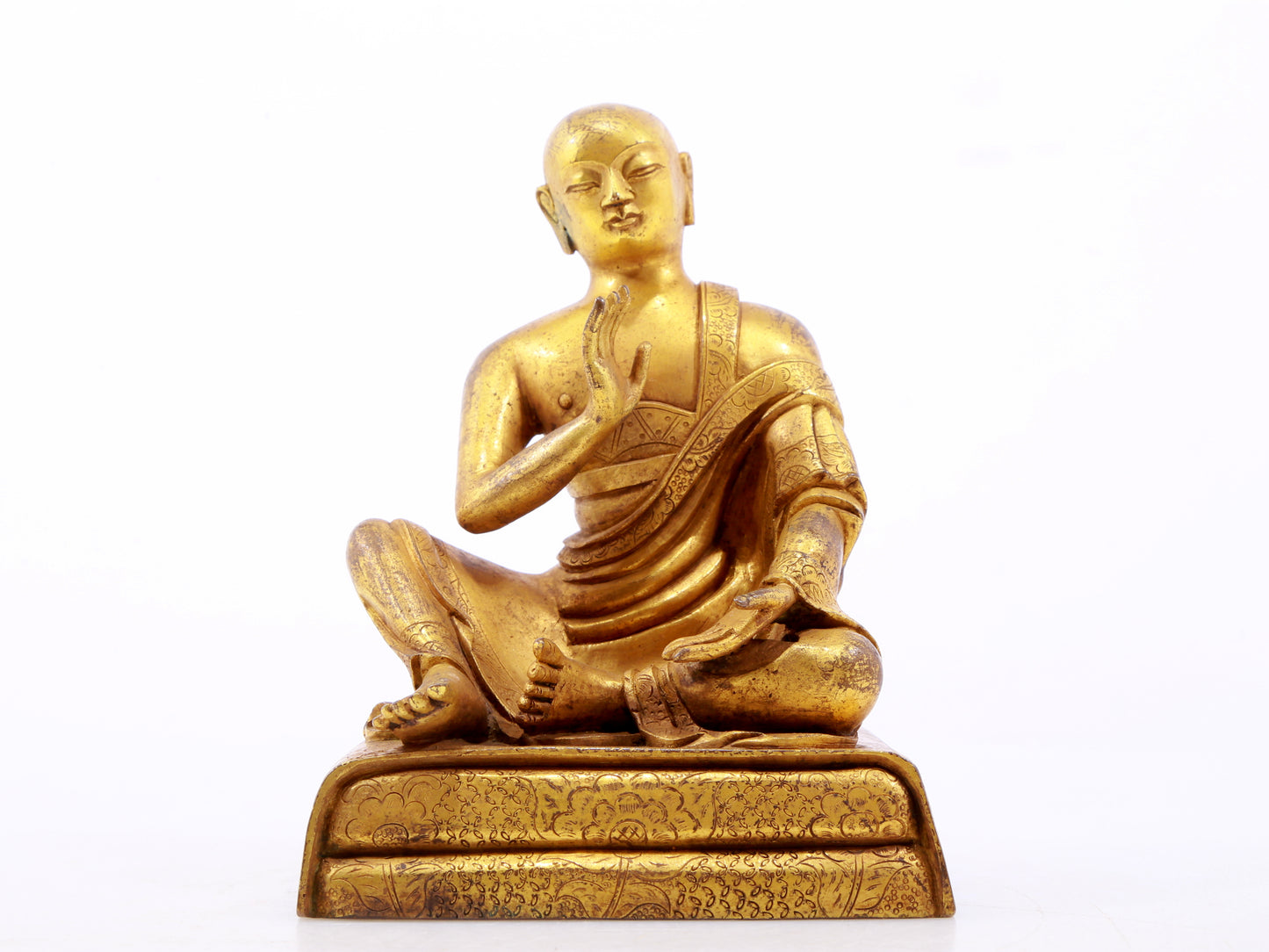 A serene gilt bronze Arhat statue,