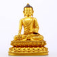 A serene gilt bronze statue of Gautama Buddha