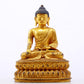 A serene gilt bronze statue of Gautama Buddha