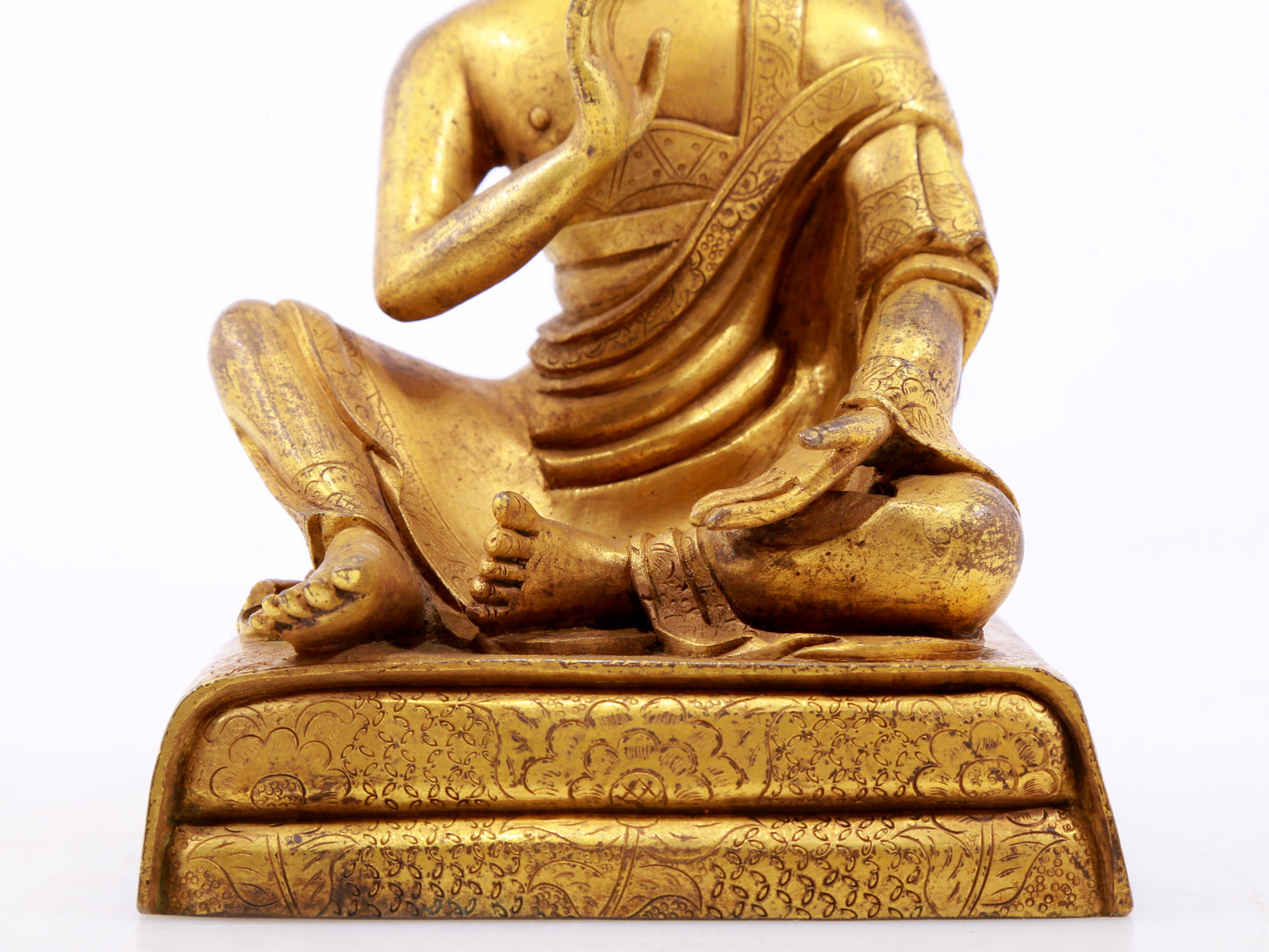 A serene gilt bronze Arhat statue,