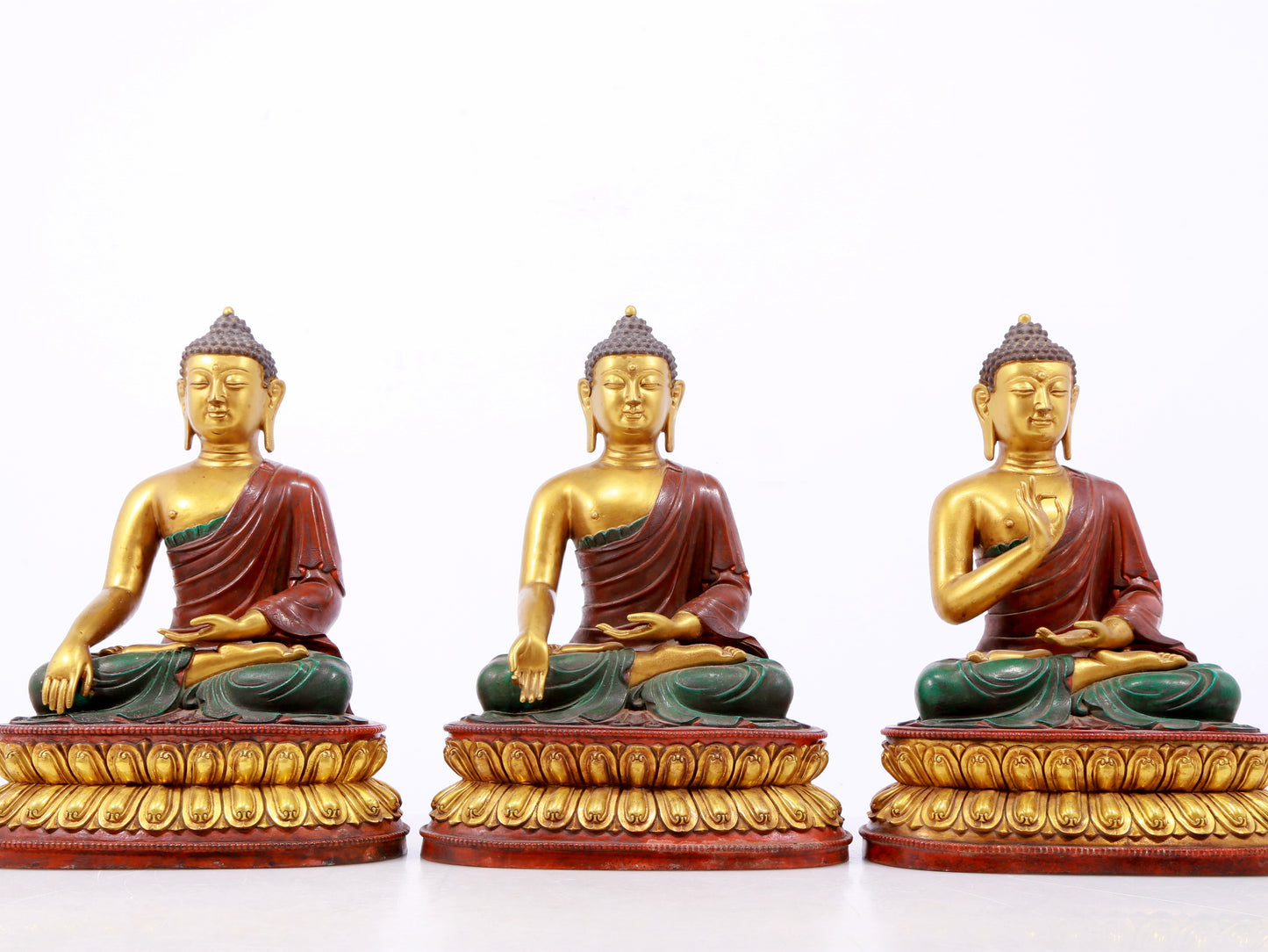 A serene gilt bronze statue of Gautama Buddha