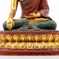 A serene gilt bronze statue of Gautama Buddha