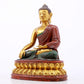 A serene gilt bronze statue of Gautama Buddha