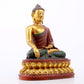 A serene gilt bronze statue of Gautama Buddha