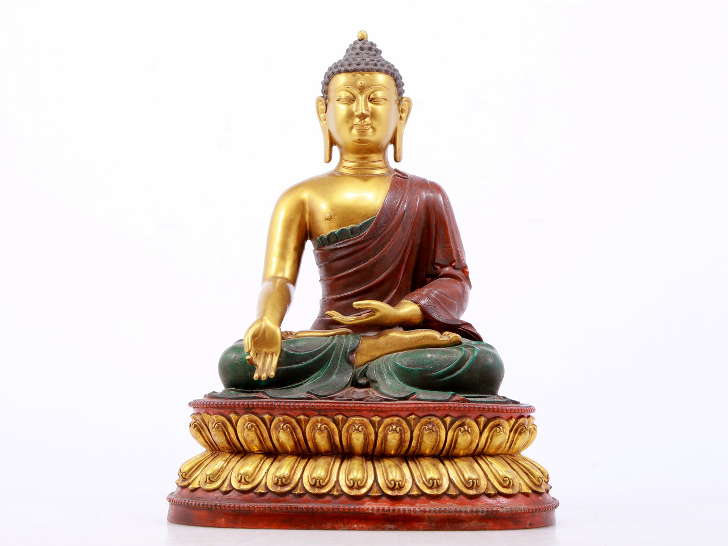 A serene gilt bronze statue of Gautama Buddha