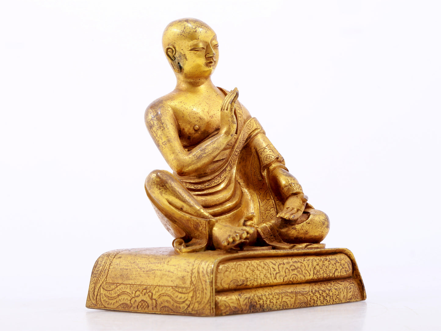 A serene gilt bronze Arhat statue,