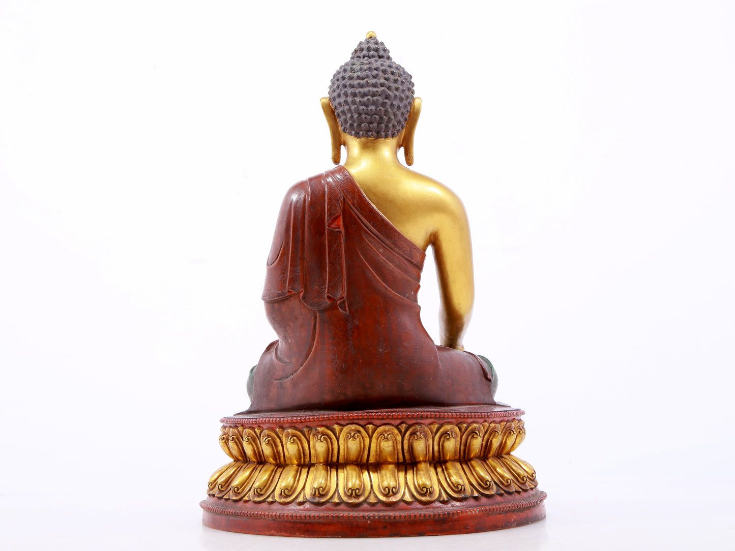 A serene gilt bronze statue of Gautama Buddha