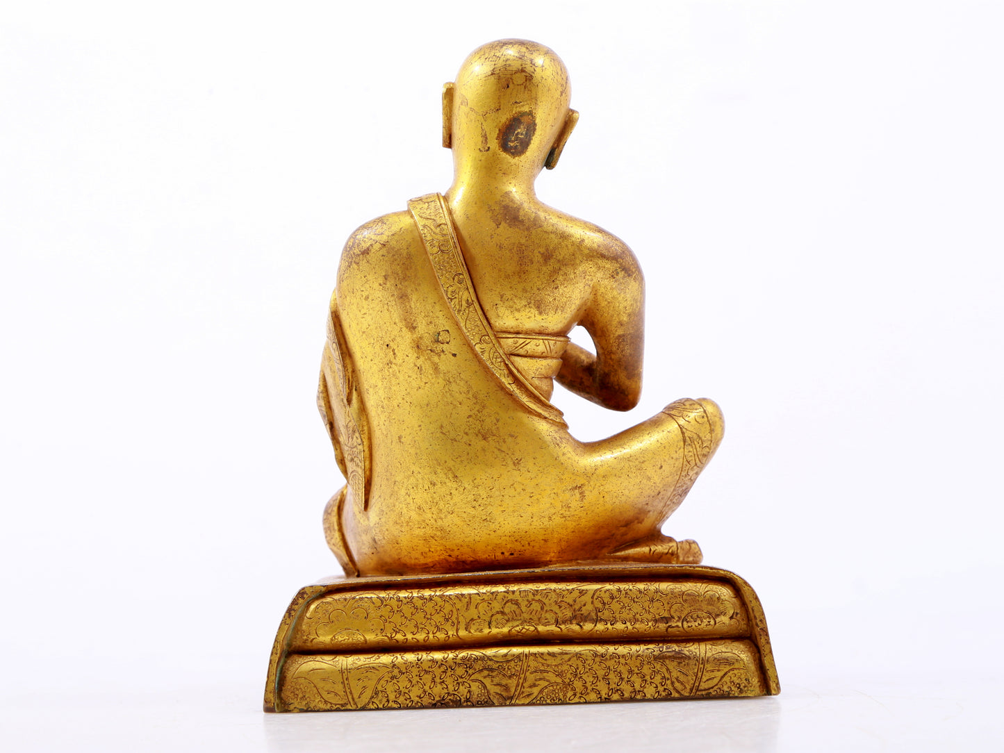 A serene gilt bronze Arhat statue,