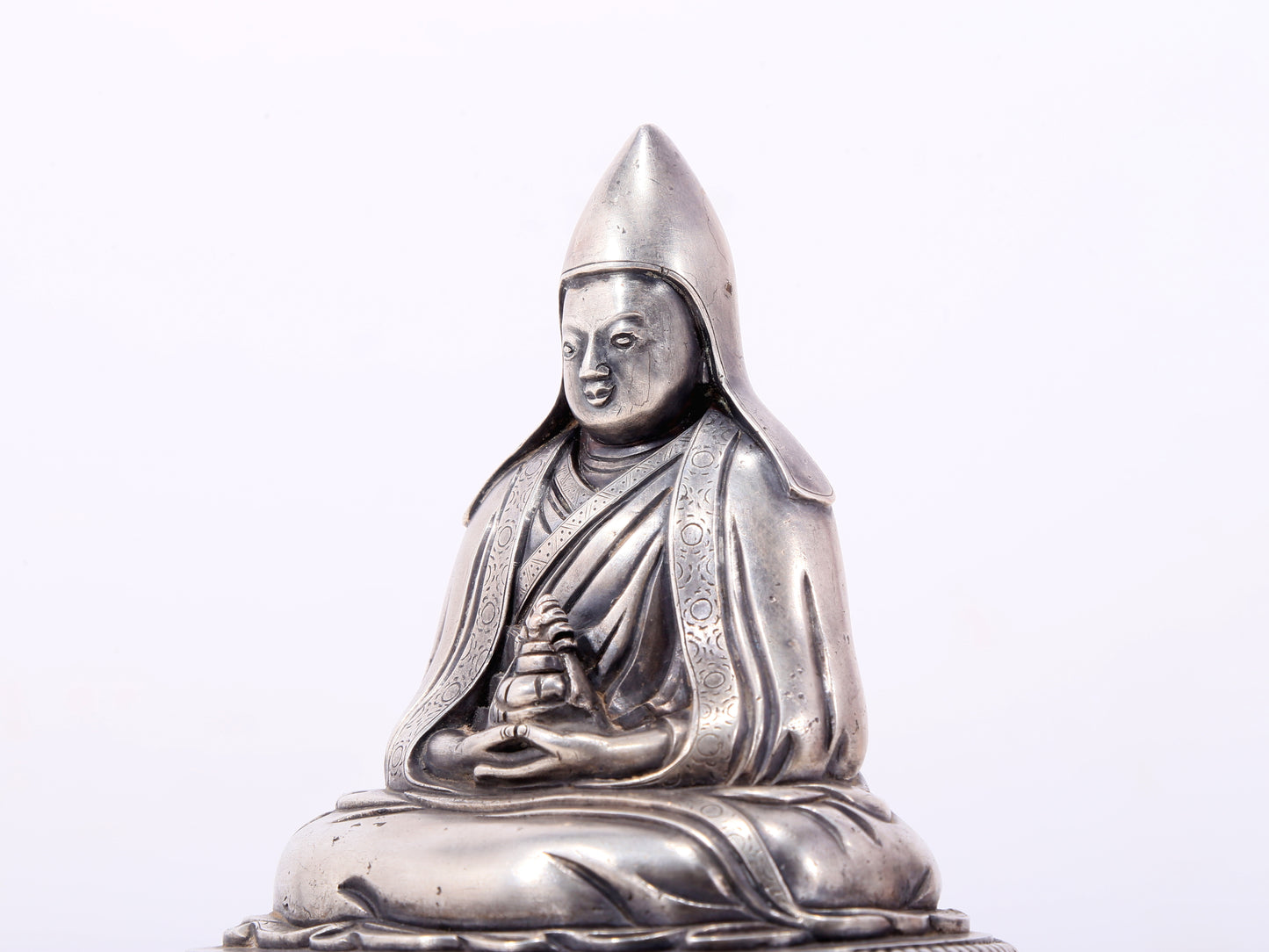 A serene gilt bronze Tsongkhapa