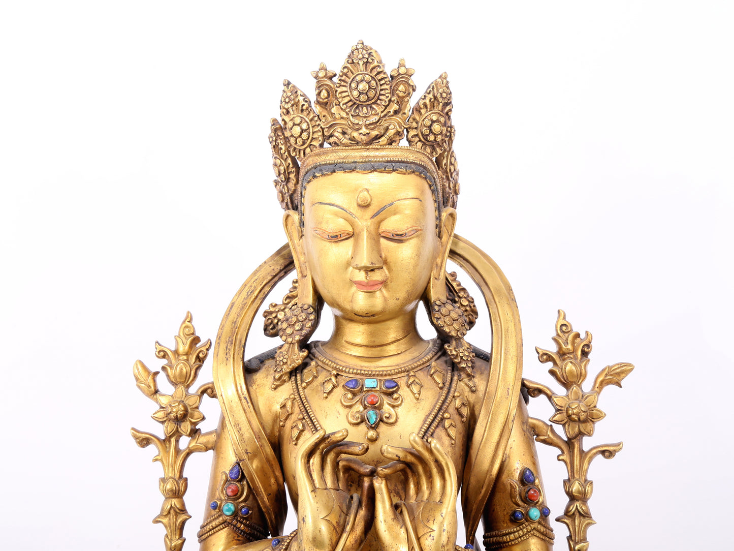 A serene gilt bronze statue of Bodhisattva inlaid with hundreds of treasures