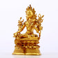 A serene gilt bronze green Tara statue