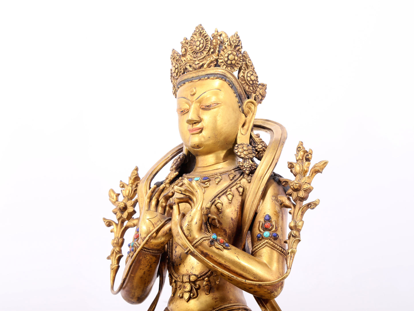 A serene gilt bronze statue of Bodhisattva inlaid with hundreds of treasures