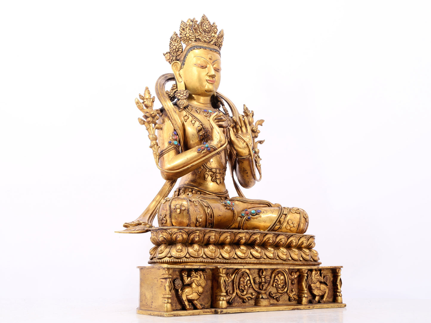 A serene gilt bronze statue of Bodhisattva inlaid with hundreds of treasures