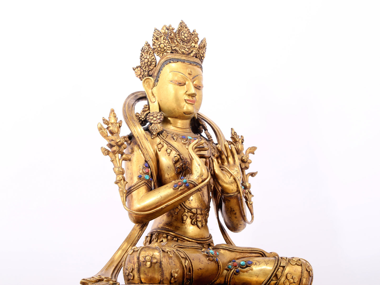 A serene gilt bronze statue of Bodhisattva inlaid with hundreds of treasures