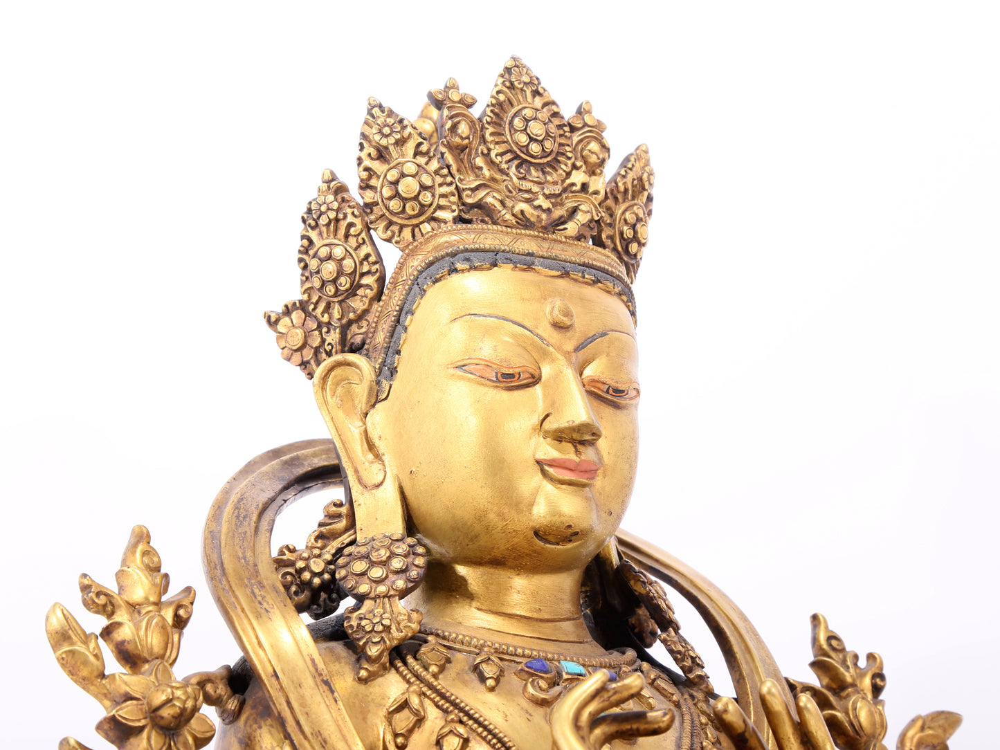 A serene gilt bronze statue of Bodhisattva inlaid with hundreds of treasures