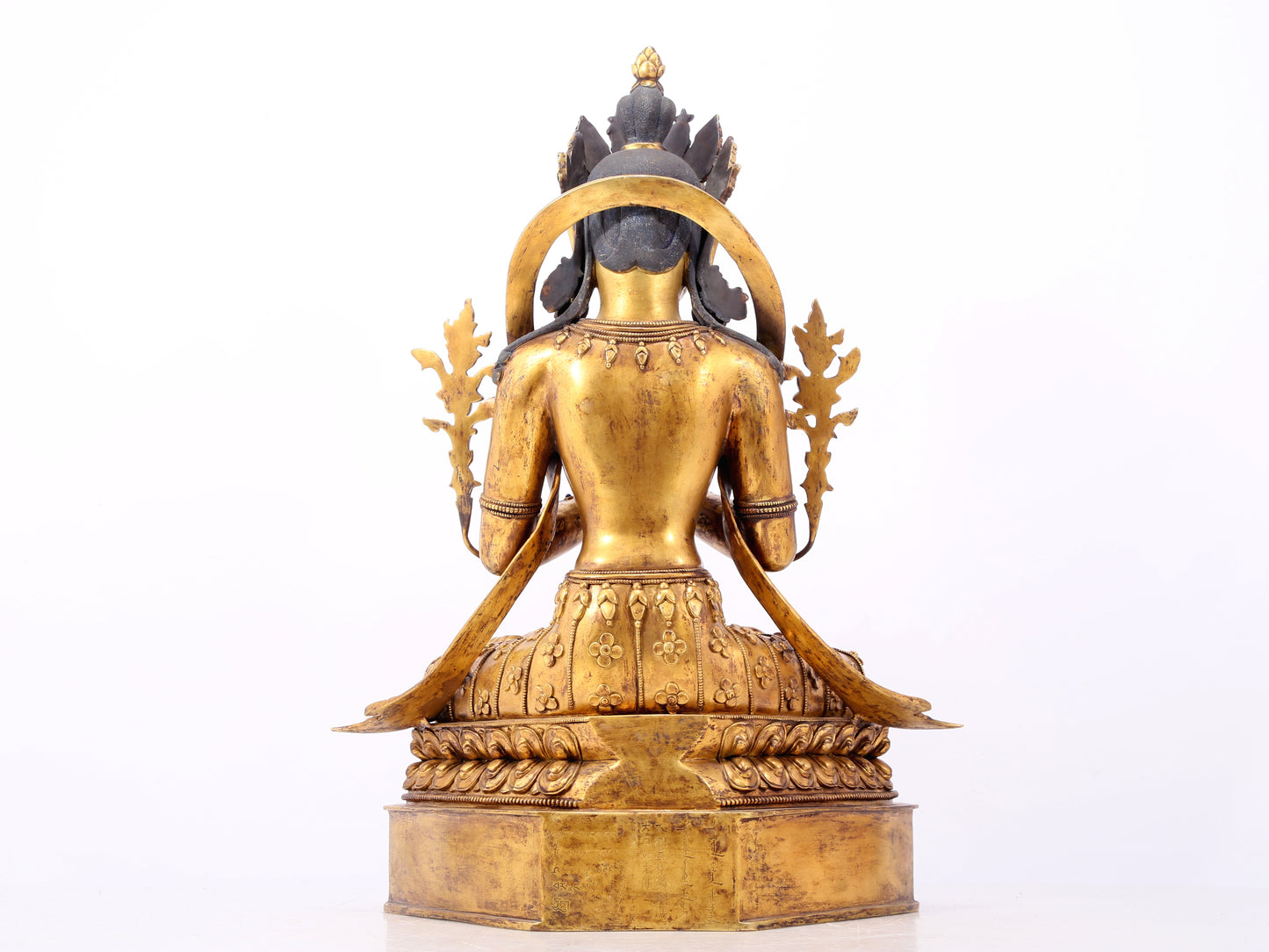 A serene gilt bronze statue of Bodhisattva inlaid with hundreds of treasures