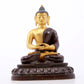 A serene gilt bronze statue of Gautama Buddha