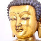 A serene gilt bronze statue of Gautama Buddha