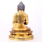 A serene gilt bronze statue of Gautama Buddha