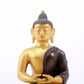 A serene gilt bronze statue of Gautama Buddha