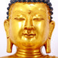 A serene gilt bronze statue of Gautama Buddha