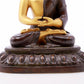 A serene gilt bronze statue of Gautama Buddha