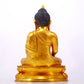 A serene gilt bronze statue of Gautama Buddha