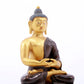 A serene gilt bronze statue of Gautama Buddha