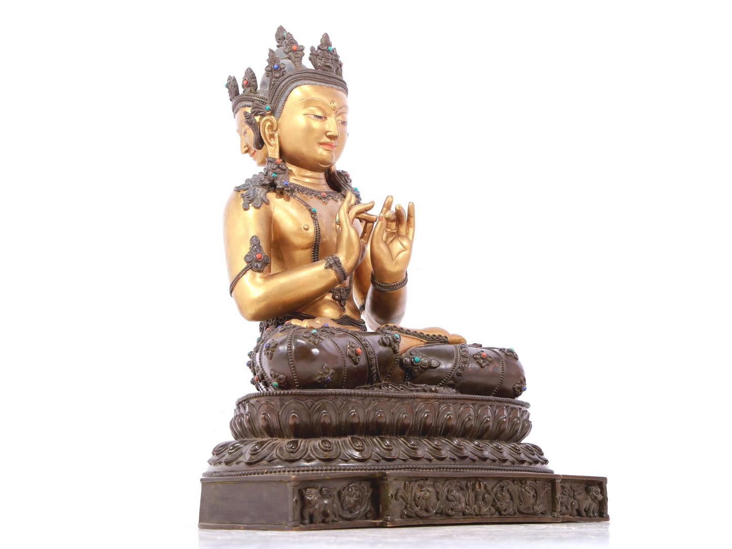 A serene gilt bronze statue of Bodhisattva inlaid with hundreds of treasures