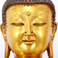 A serene gilt bronze statue of Gautama Buddha