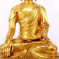 A serene gilt bronze statue of Gautama Buddha