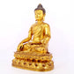 A serene gilt bronze statue of Gautama Buddha