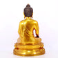 A serene gilt bronze statue of Gautama Buddha