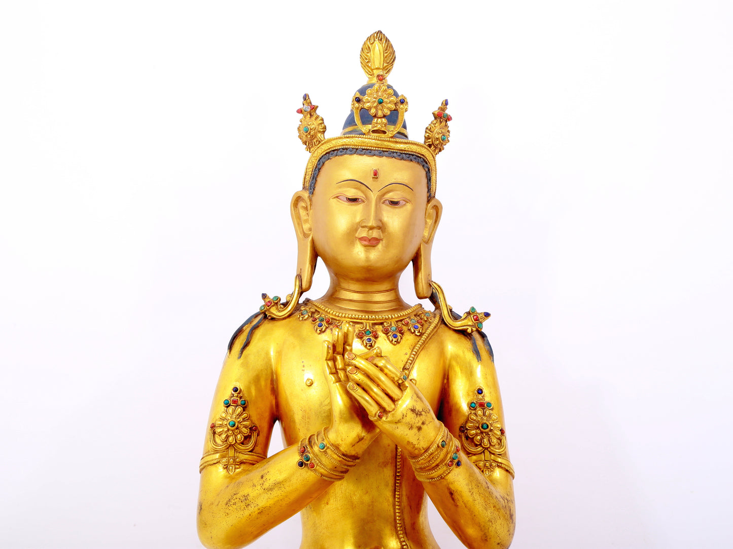 A serene gilt bronze statue of Bodhisattva inlaid with hundreds of treasures