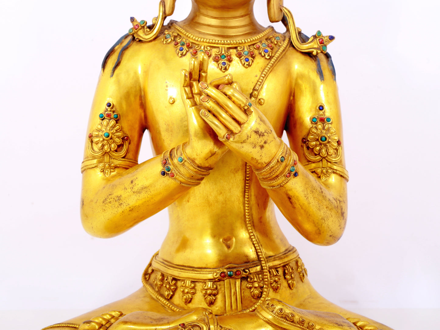 A serene gilt bronze statue of Bodhisattva inlaid with hundreds of treasures