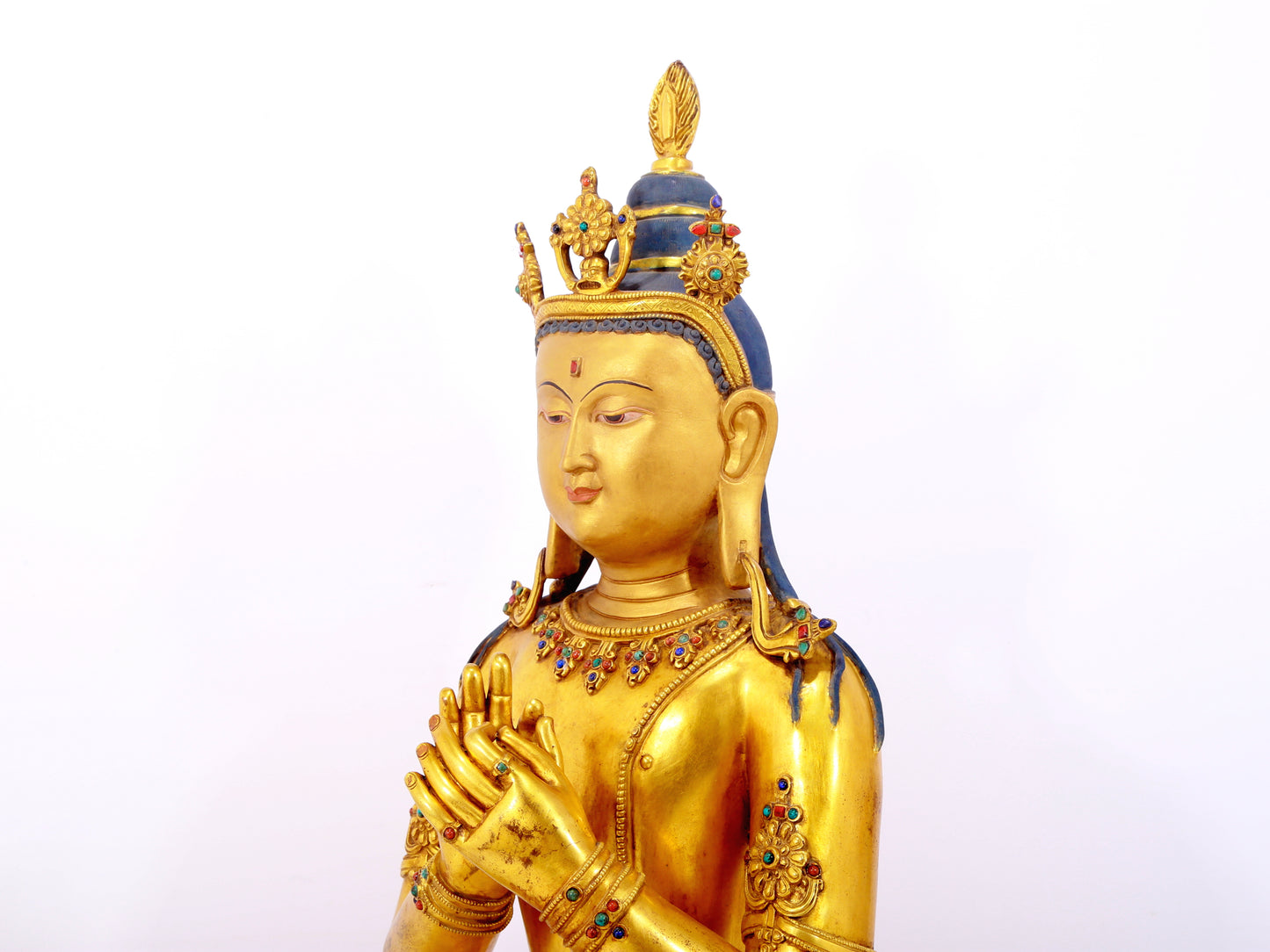 A serene gilt bronze statue of Bodhisattva inlaid with hundreds of treasures