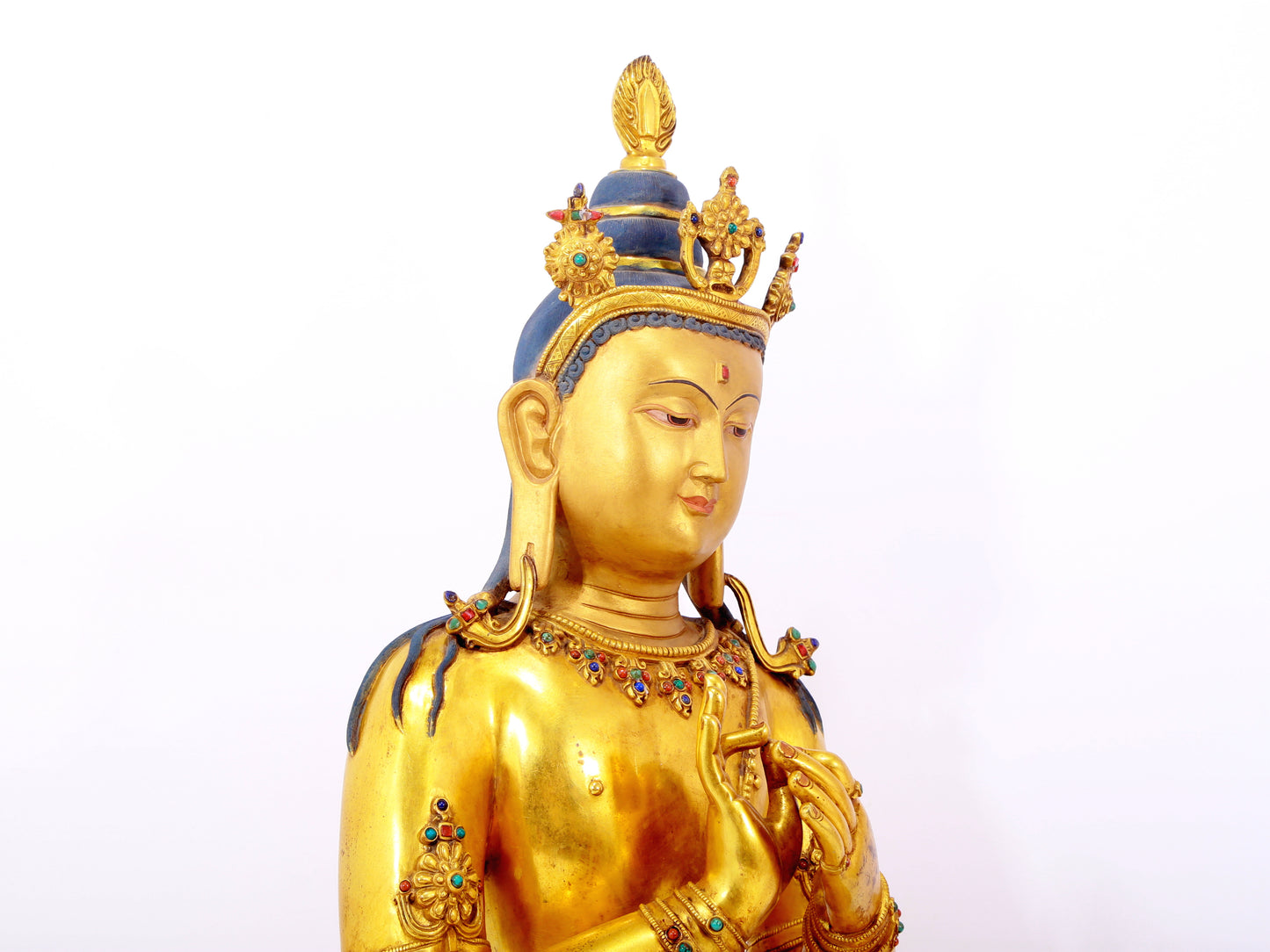 A serene gilt bronze statue of Bodhisattva inlaid with hundreds of treasures