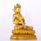 A serene gilt bronze statue of Amitayus Buddha