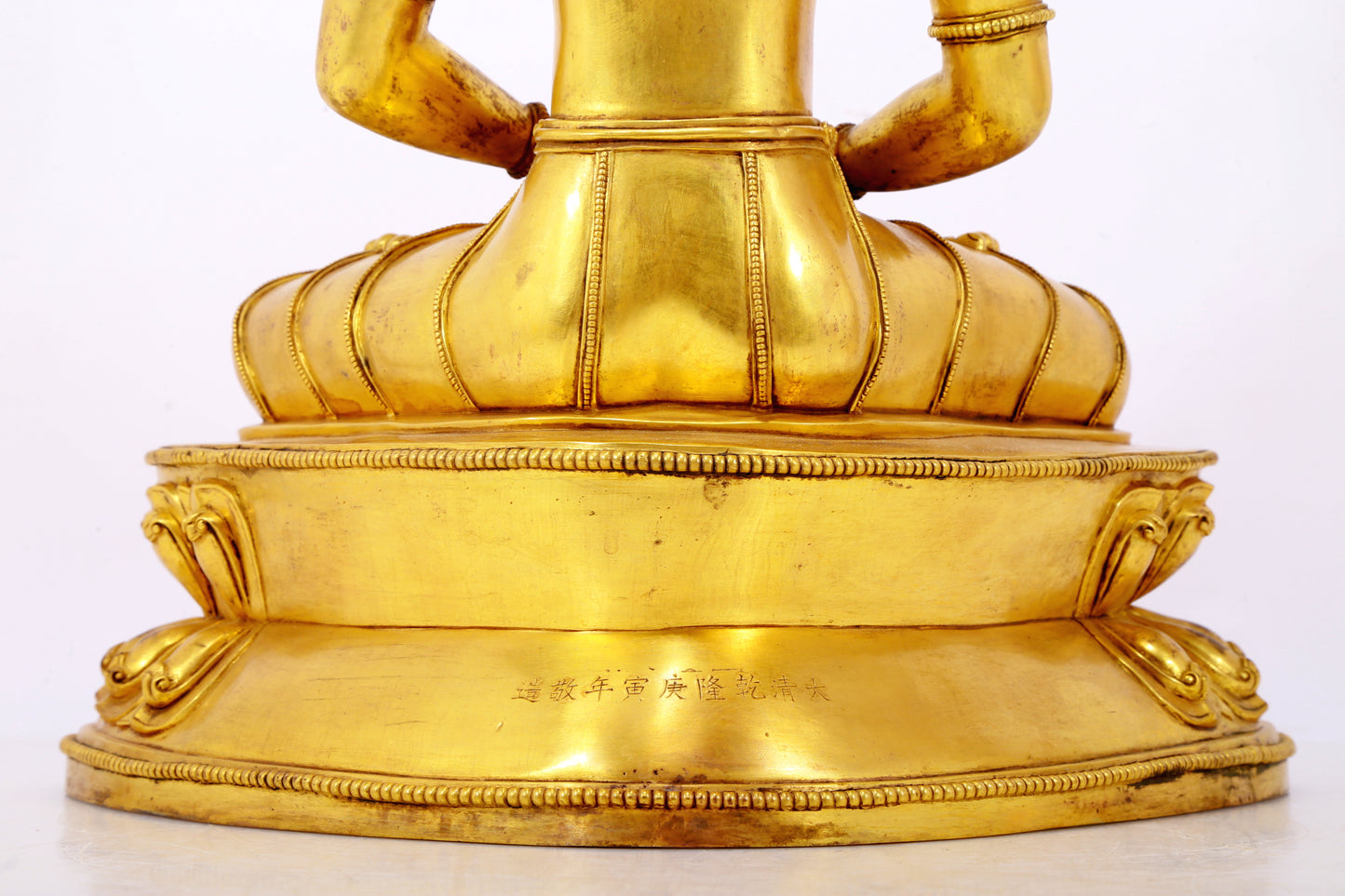 A serene gilt bronze statue of Amitayus Buddha