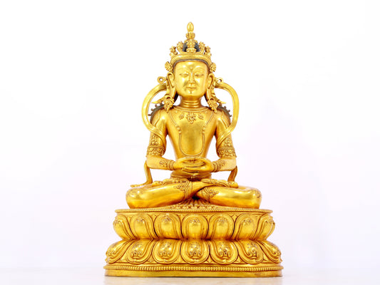 A serene gilt bronze statue of Amitayus Buddha