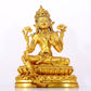 A serene gilt bronze statue of Tara inlaid with sapphire green