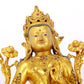 A serene gilt bronze statue of Tara inlaid with sapphire green