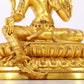 A serene gilt bronze statue of Tara inlaid with sapphire green