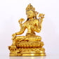 A serene gilt bronze statue of Tara inlaid with sapphire green