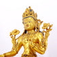 A serene gilt bronze statue of Tara inlaid with sapphire green