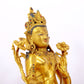 A serene gilt bronze statue of Tara inlaid with sapphire green