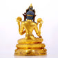 A serene gilt bronze statue of Tara inlaid with sapphire green