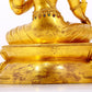 A serene gilt bronze statue of Tara inlaid with sapphire green