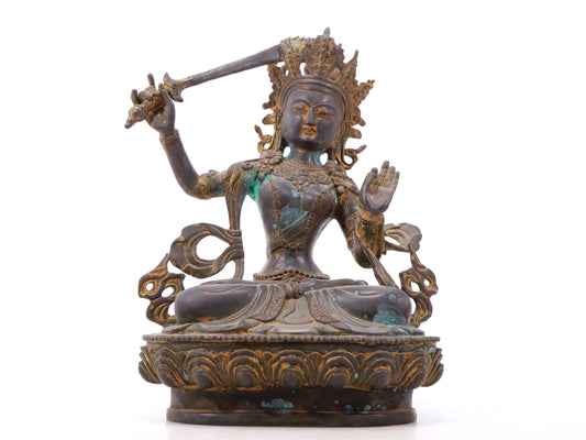 A serene gilt bronze statue of Manjushri Bodhisattva